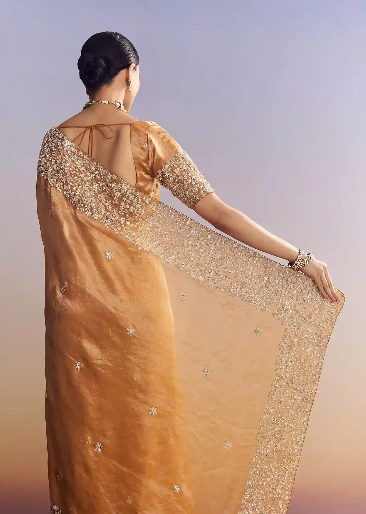 Imperial Gold-Orange Tissue Saree with Heavy Embroidered Border – Elite Trade & Trend Edition