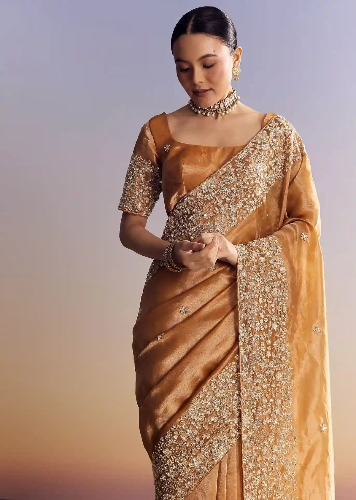 Imperial Gold-Orange Tissue Saree with Heavy Embroidered Border – Elite Trade & Trend Edition